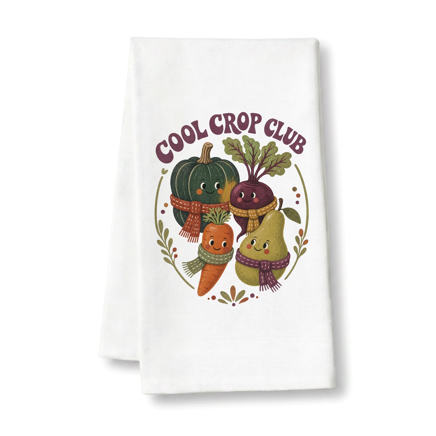 Cool Crop Club Harvest Tea Towel folded on a clean white background, showing smiling squash, beet, carrot, and pear characters wearing scarves.