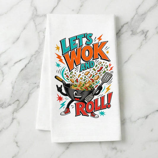 Let's Wok and Roll funny wok cooking pun organic cotton kitchen towel styled on a white marble surface.