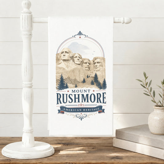 Mount Rushmore Heritage Tea Towel displayed on a towel stand