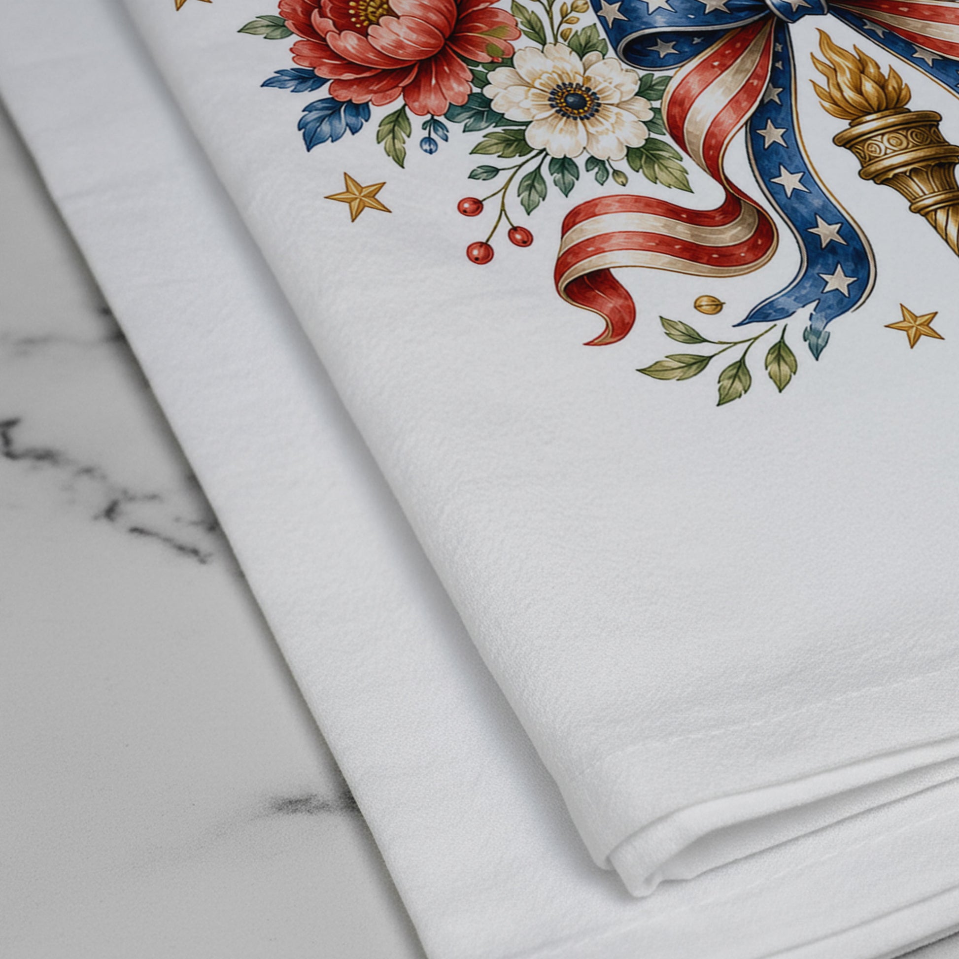 Close-up of America 250 botanical wreath tea towel artwork with patriotic flowers, stars, fireworks, and red white and blue details
