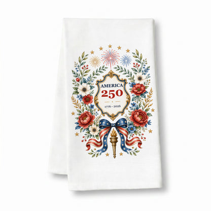 America 250 botanical wreath tea towel on a clean white background with floral patriotic artwork, fireworks, stars, bow, torch, and 1776 to 2026 seal