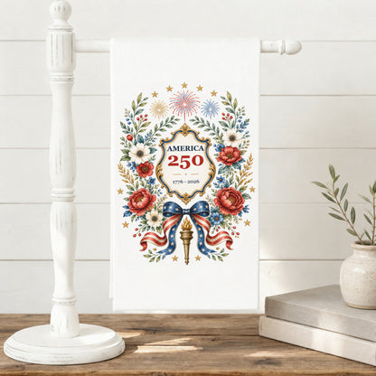 America 250 botanical wreath tea towel displayed on a towel stand with patriotic floral anniversary artwork