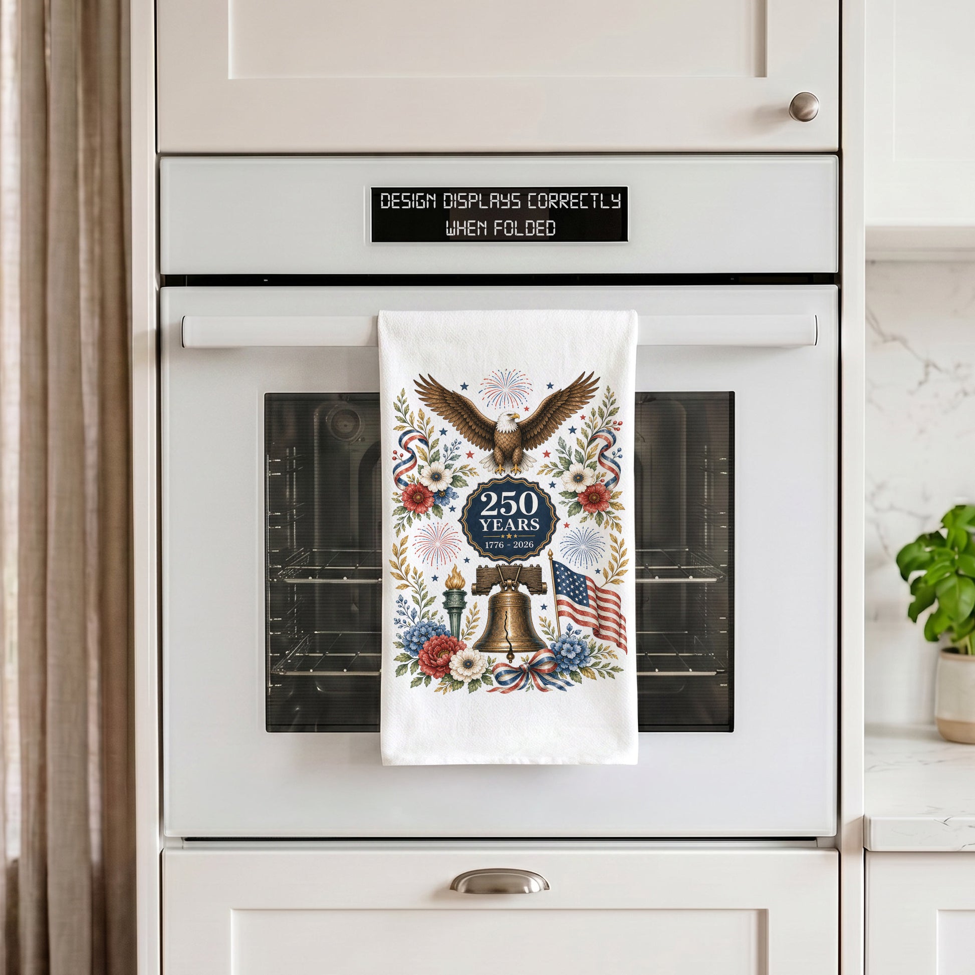 America 250 eagle heritage tea towel hanging on an oven handle