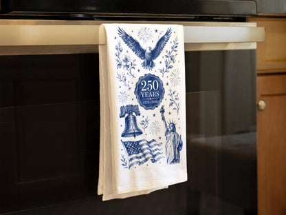 Folded navy toile America 250th anniversary tea towel on an oven handle, showing how the design displays when folded