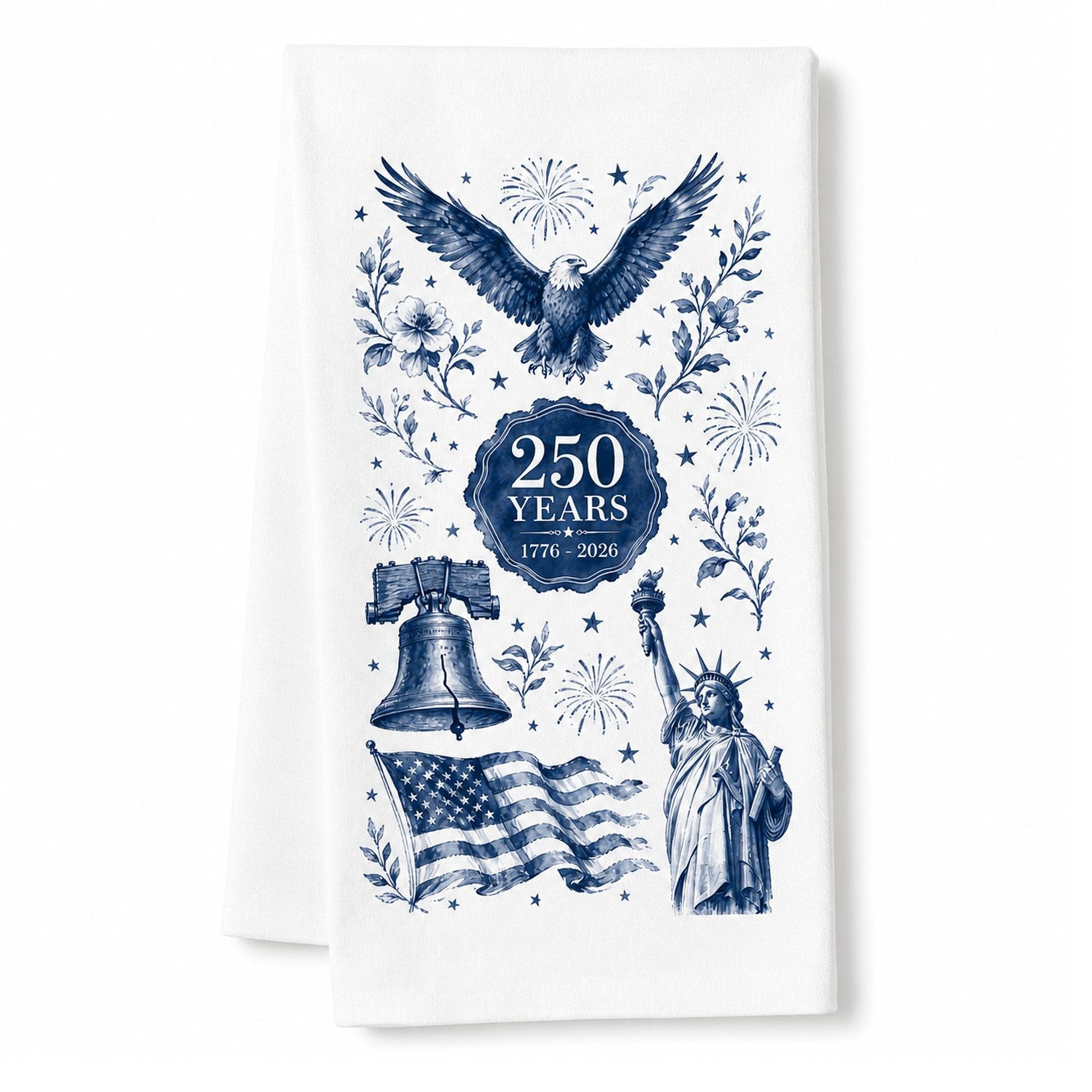 America 250th anniversary navy toile tea towel centered on a clean white background, folded white organic cotton towel with eagle, Liberty Bell, Statue of Liberty, American flag and 250 Years 1776-2026 artwork