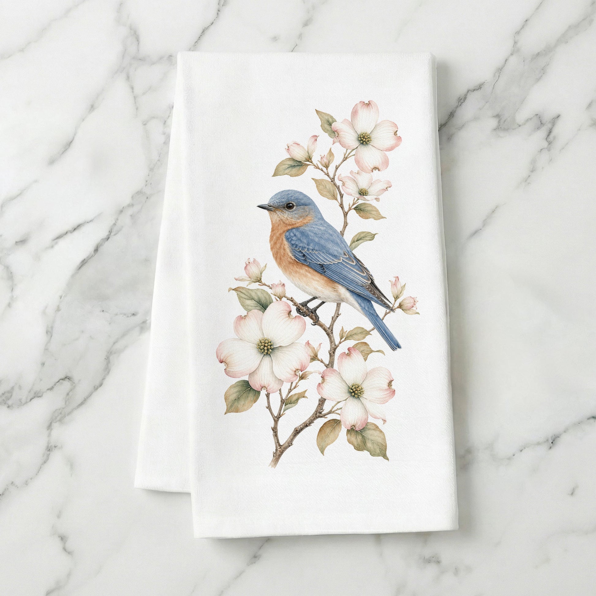 Bluebird and dogwood tea towel styled on marble