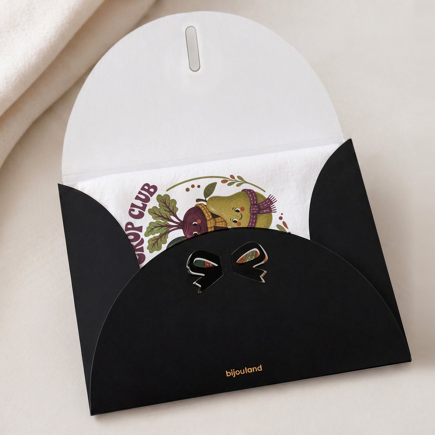 Cool Crop Club Harvest Tea Towel shown with the black Bijouland gift-envelope packaging option.