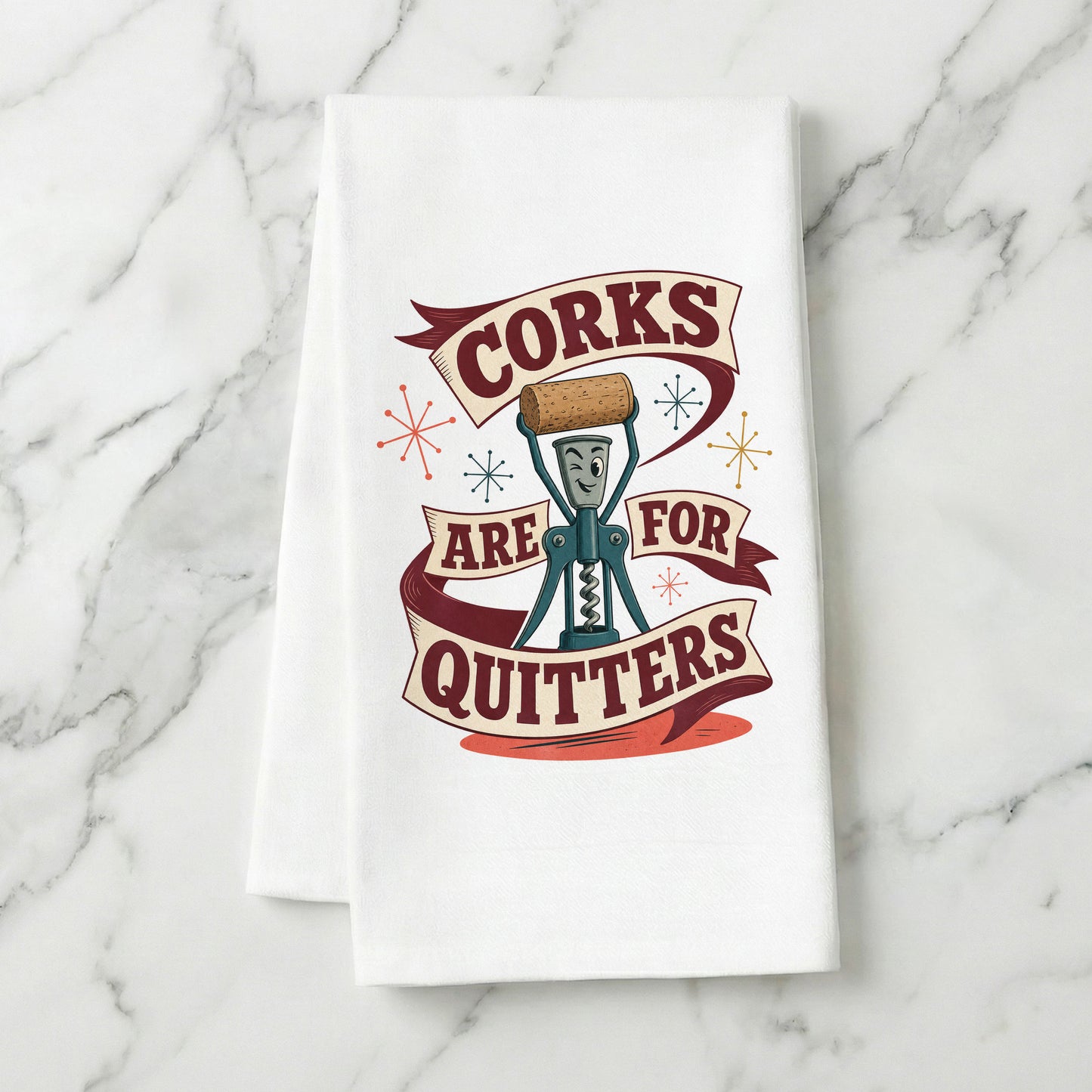 Corks Are for Quitters kitchen towel displayed on a light marble surface.