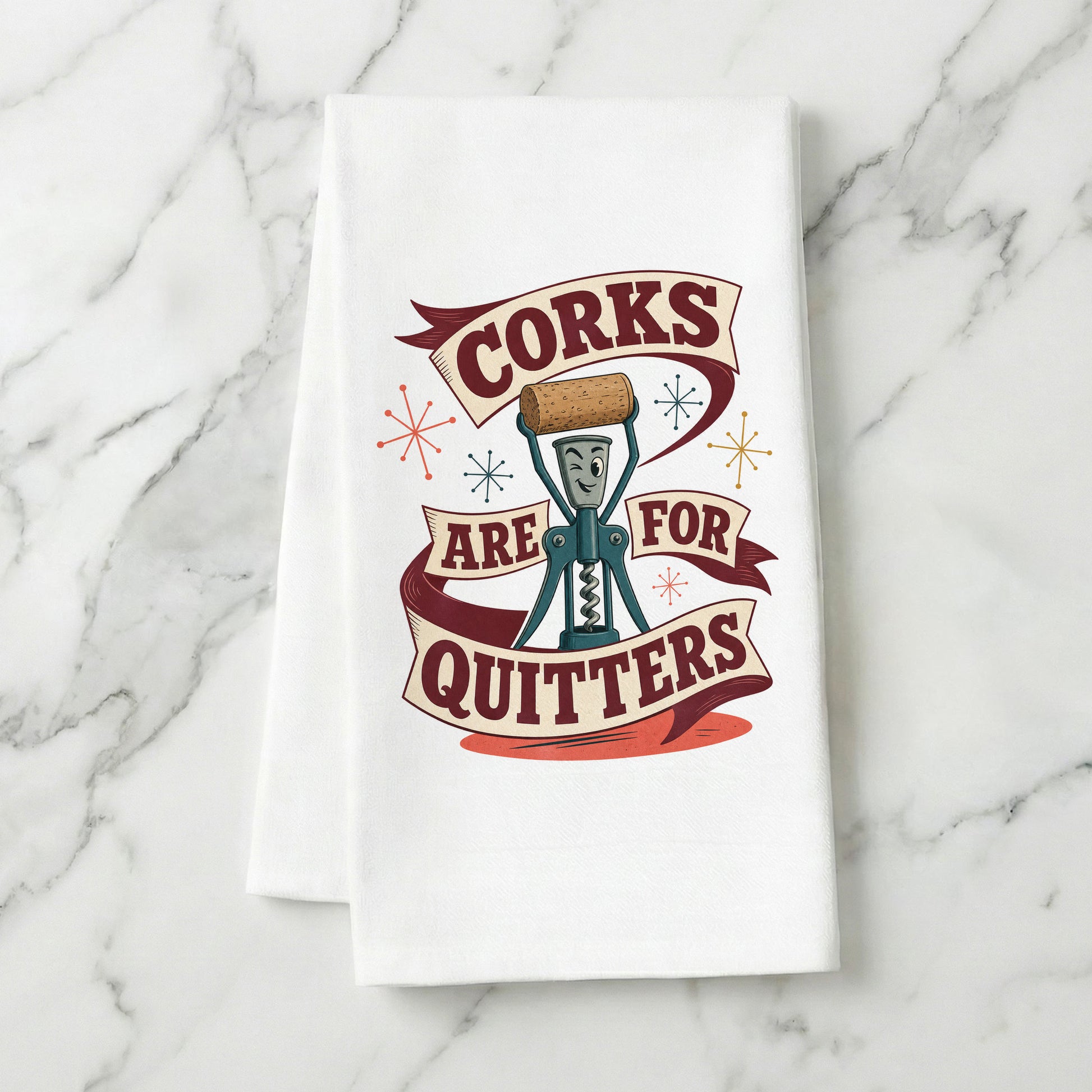 Corks Are for Quitters kitchen towel displayed on a light marble surface.