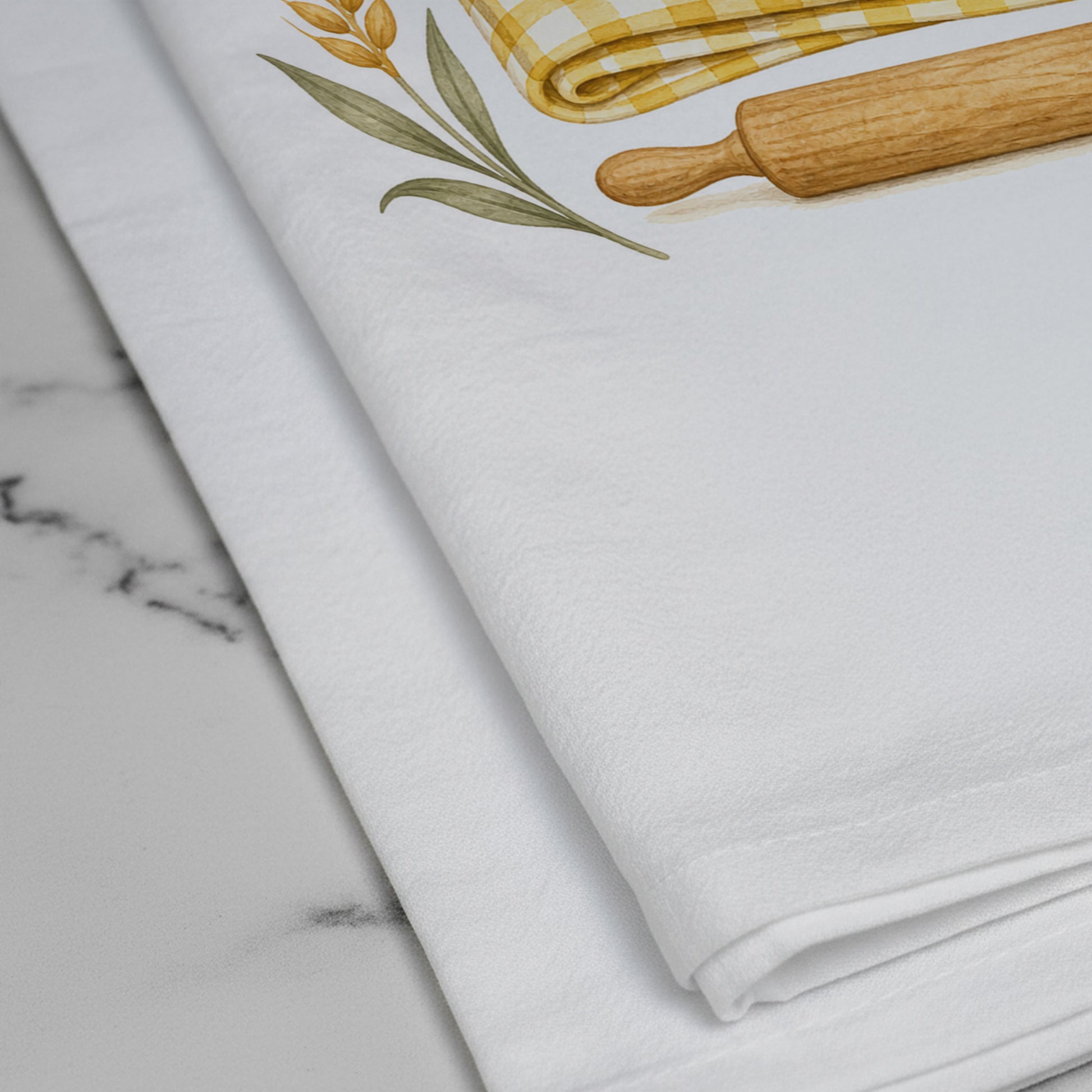 Close-up of the printed sourdough loaf artwork on the Knead Less Rest More cotton tea towel.