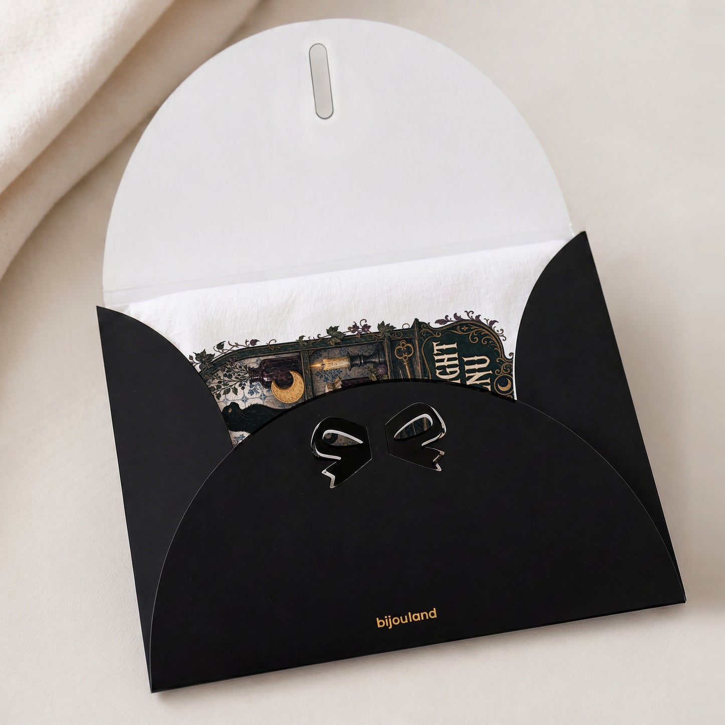 Midnight Menu Black Cat Halloween Kitchen Towel shown with the black Bijouland gift-envelope packaging option.
