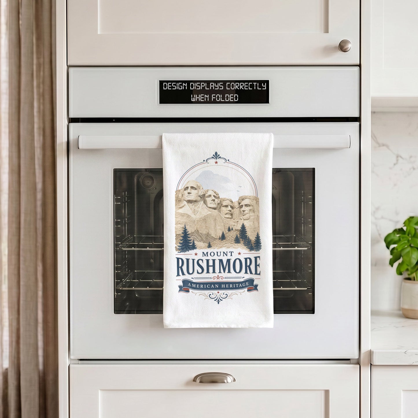 Mount Rushmore Heritage Tea Towel styled on an oven handle