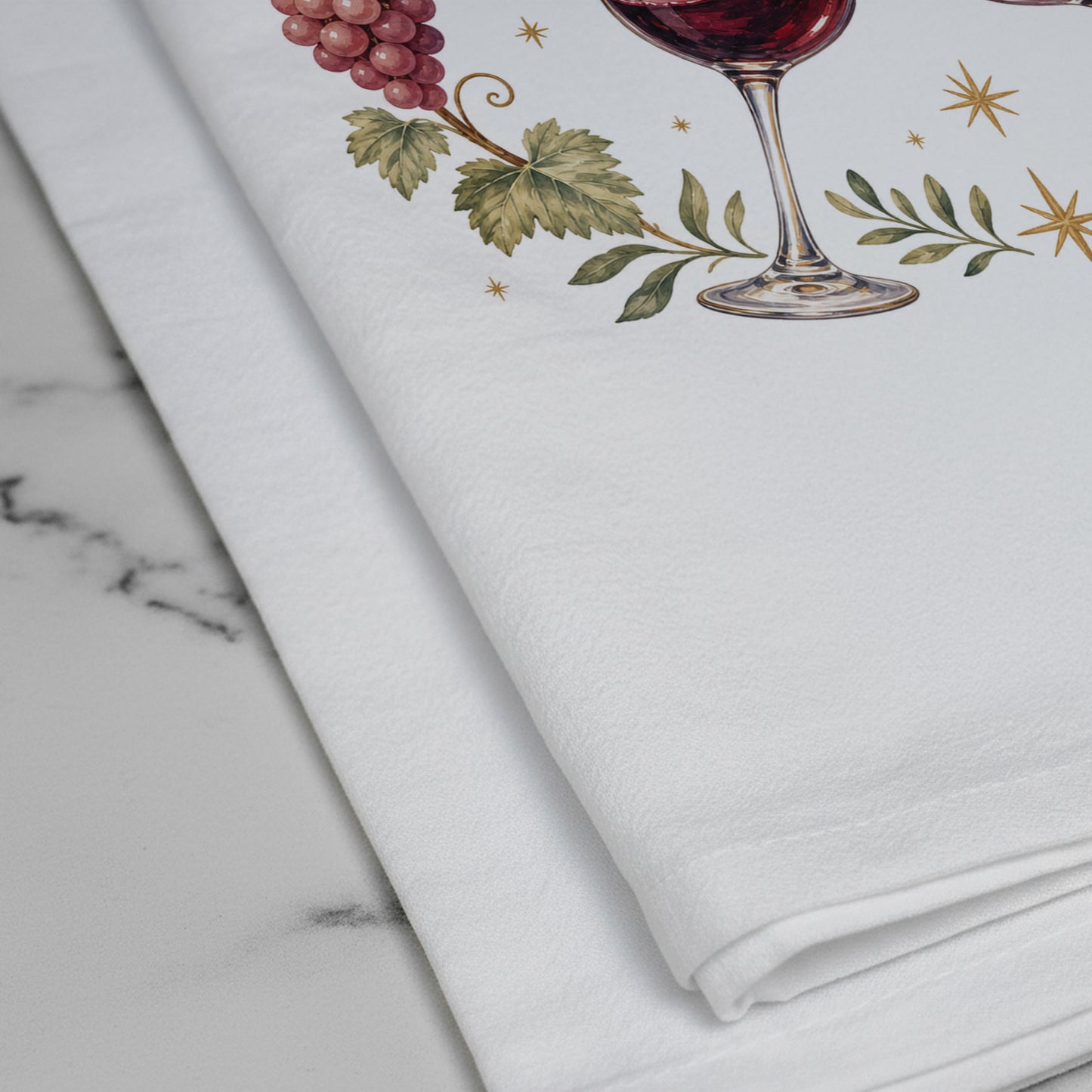 Close-up of the Partners in Wine grapevine and wine glass artwork printed on the towel.