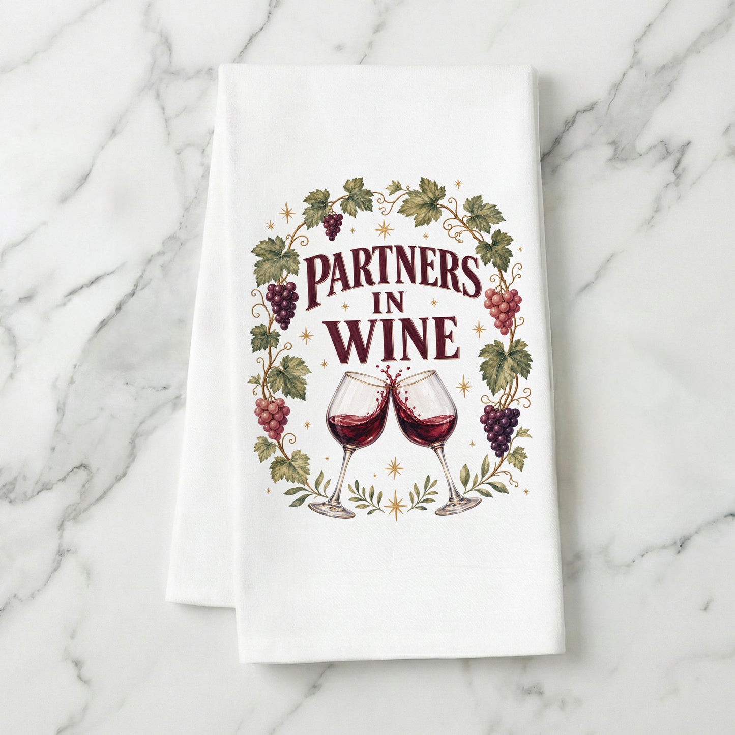Partners in Wine kitchen towel displayed on a light marble surface.
