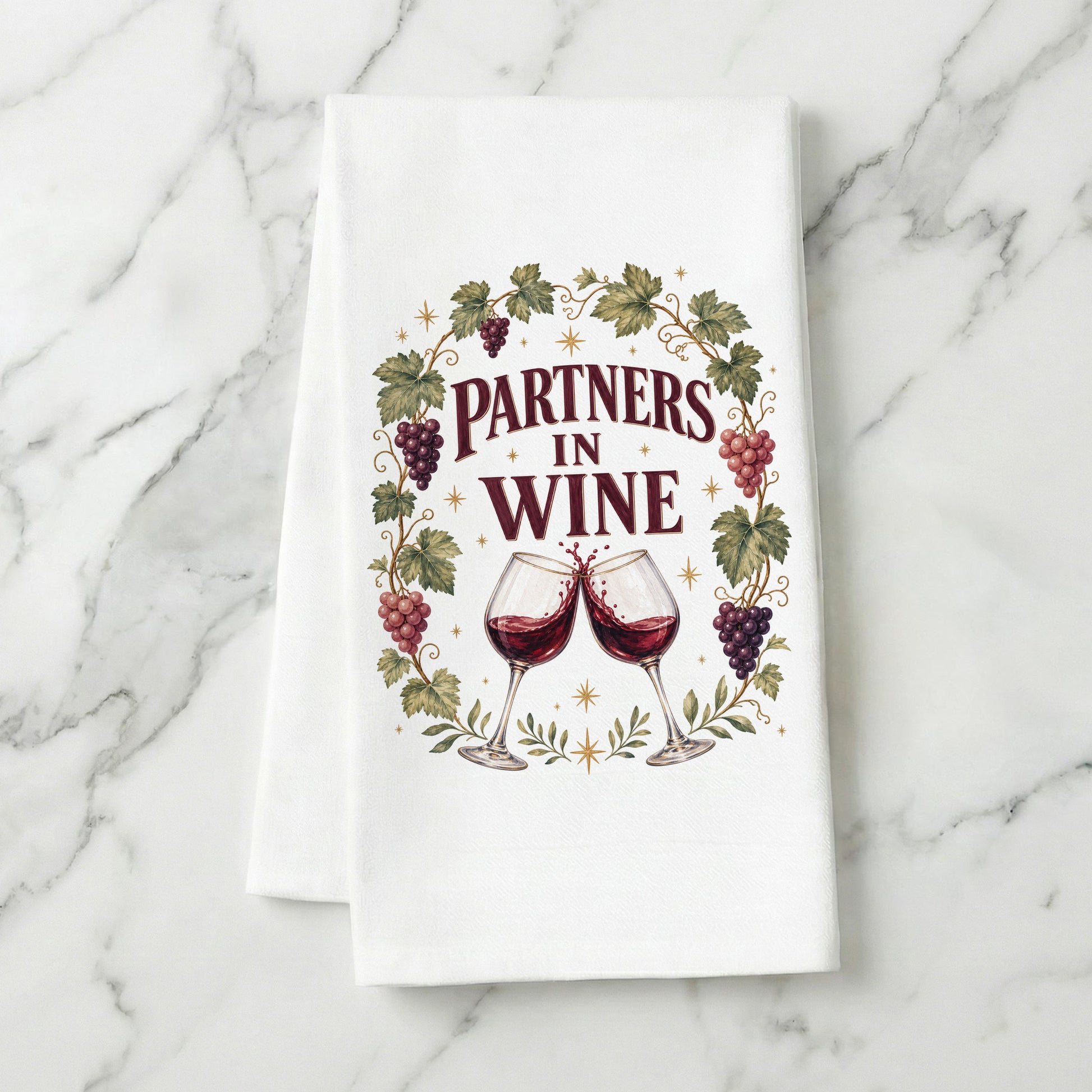 Partners in Wine kitchen towel displayed on a light marble surface.
