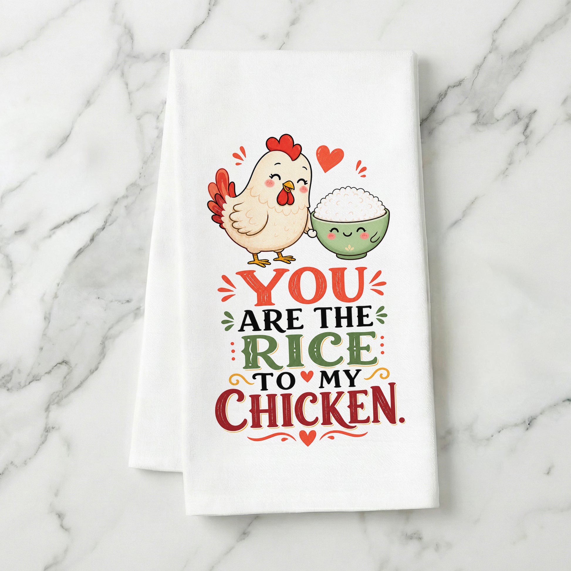 You Are the Rice to My Chicken kawaii food pun organic cotton kitchen towel styled on a white marble surface.