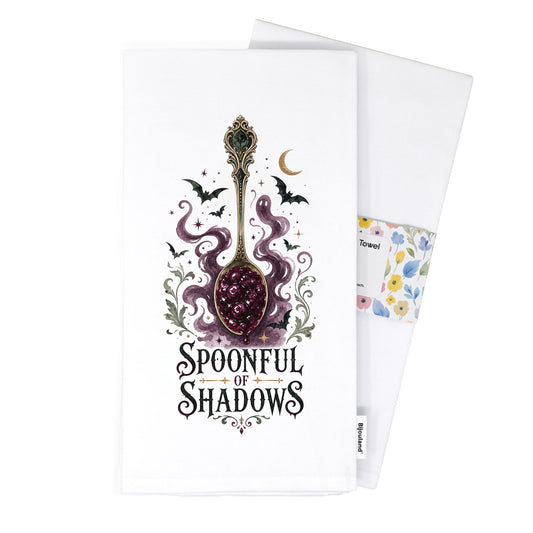 Folded Spoonful of Shadows Gothic Halloween Kitchen Towel presented with its paper belly band and woven label.