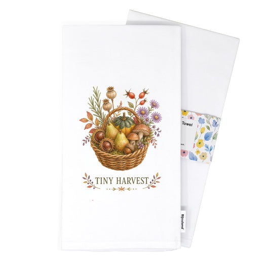 Folded Tiny Harvest Autumn Tea Towel presented with its paper belly band and woven label.