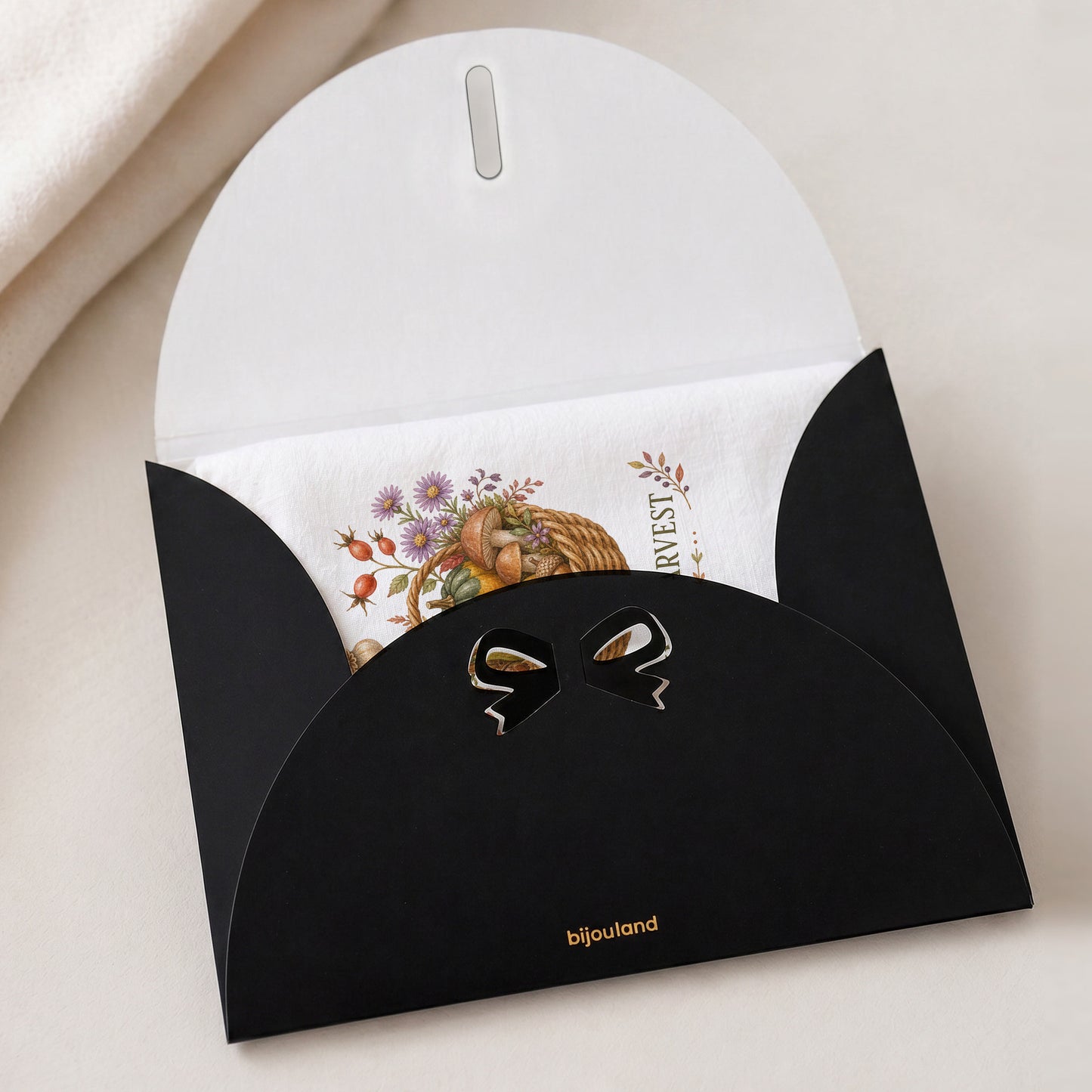 Tiny Harvest Autumn Tea Towel shown with the black Bijouland gift-envelope packaging option.