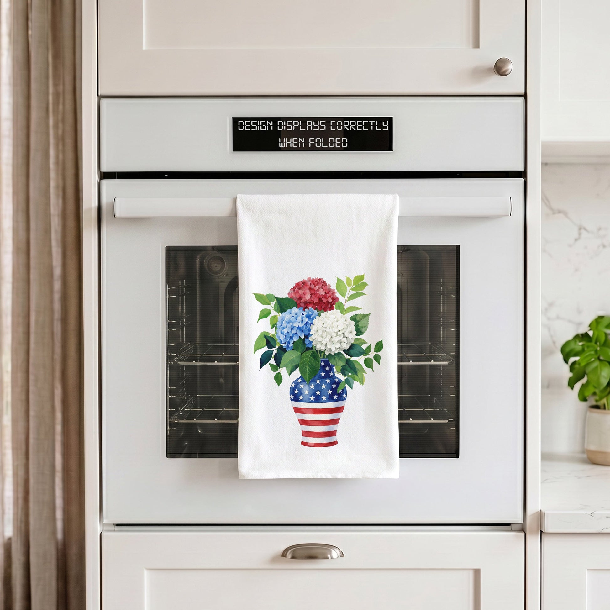 USA hydrangea vase tea towel hanging from an oven handle