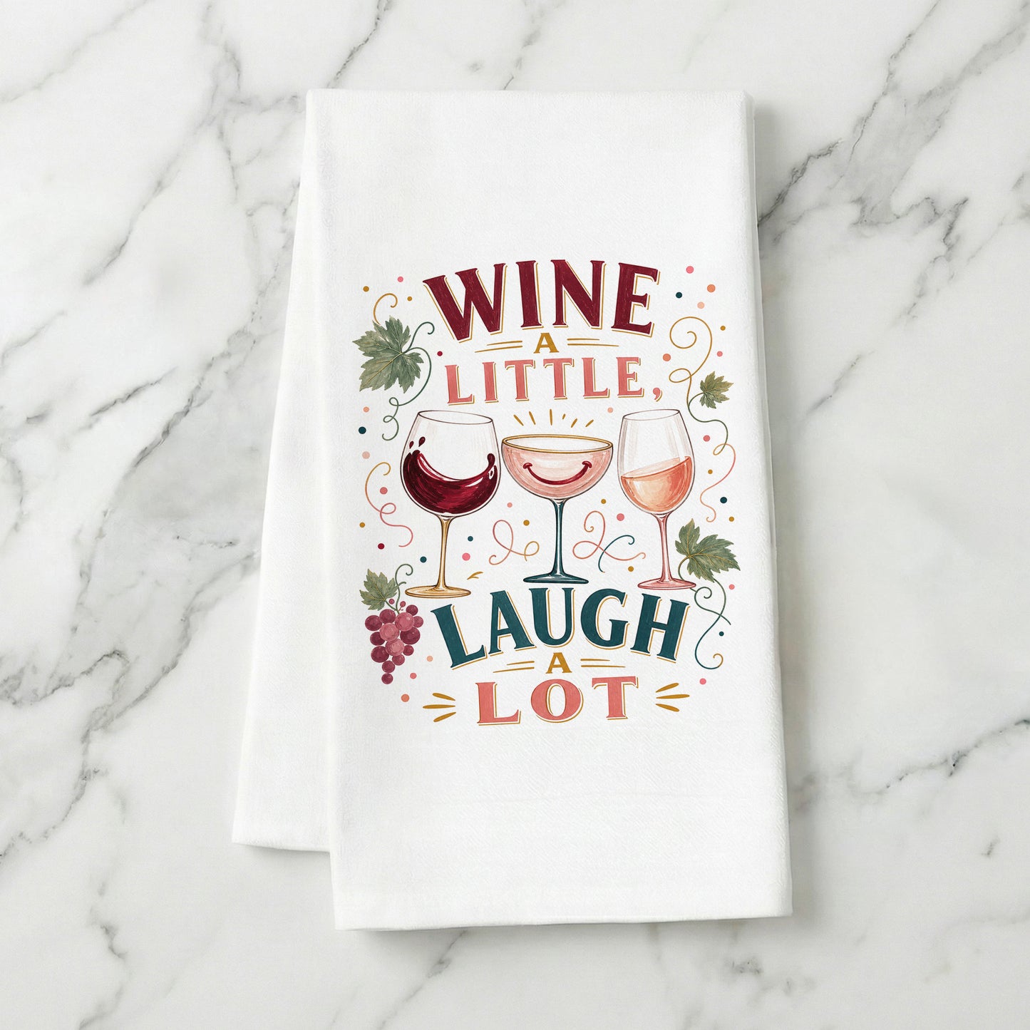 Wine a Little, Laugh a Lot tea towel styled on a marble surface.