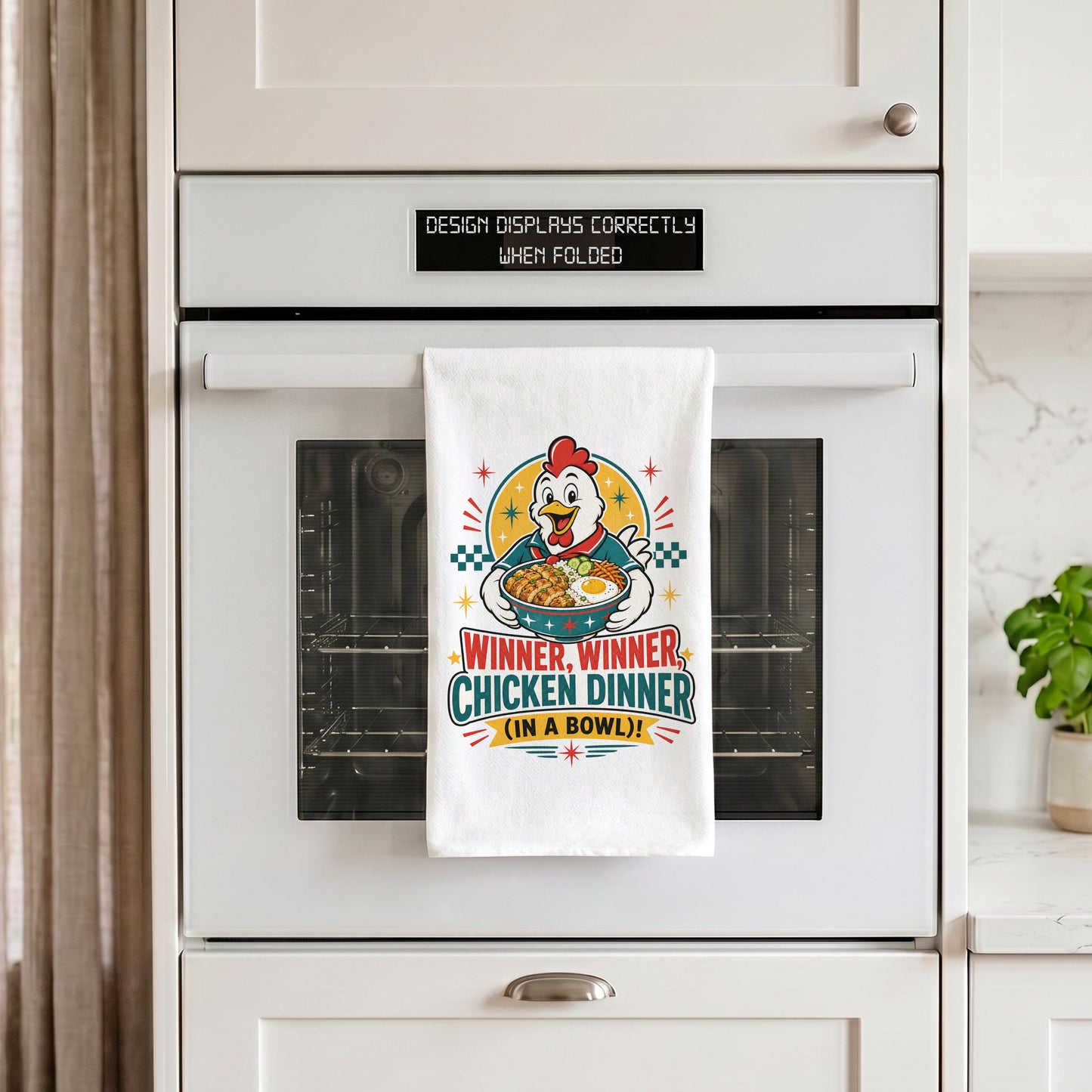 White Winner Winner Chicken Dinner chicken and rice bowl kitchen towel draped over an oven handle.