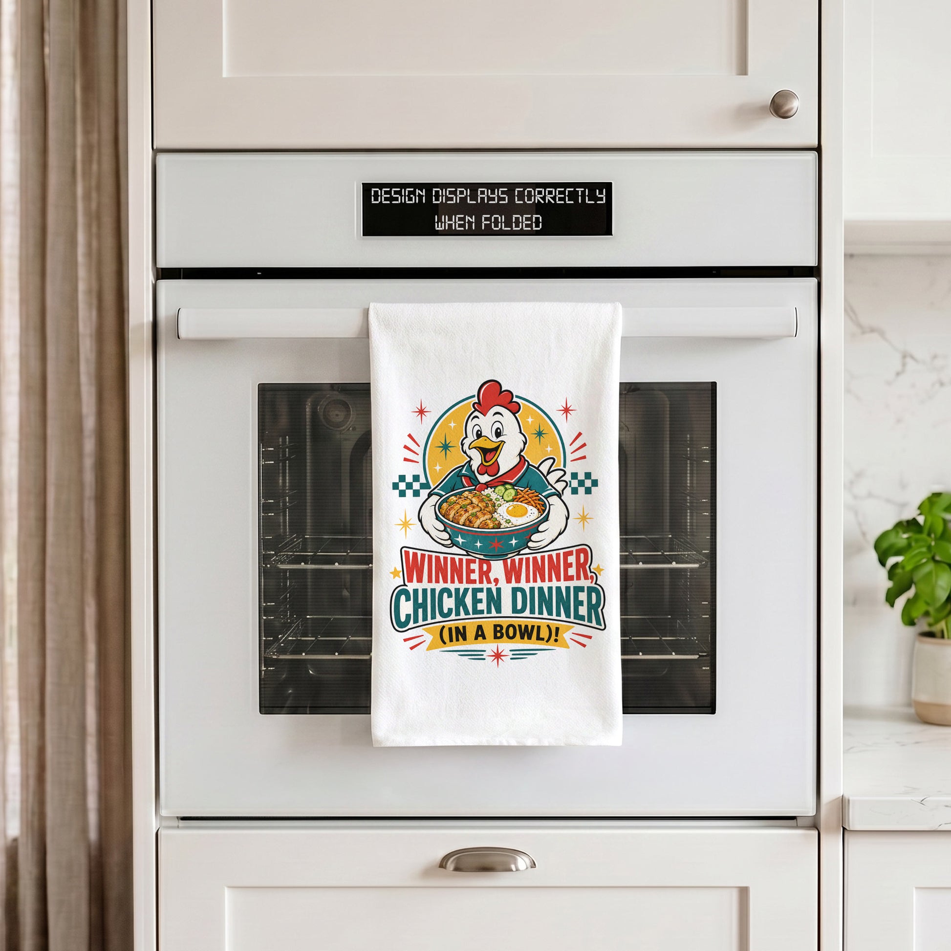 White Winner Winner Chicken Dinner chicken and rice bowl kitchen towel draped over an oven handle.